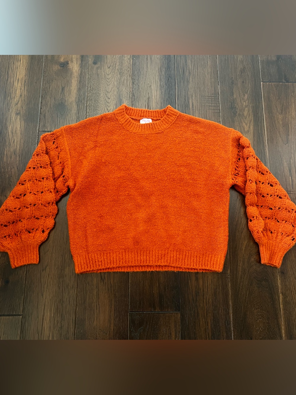 She’s the center of attention rust sweater
